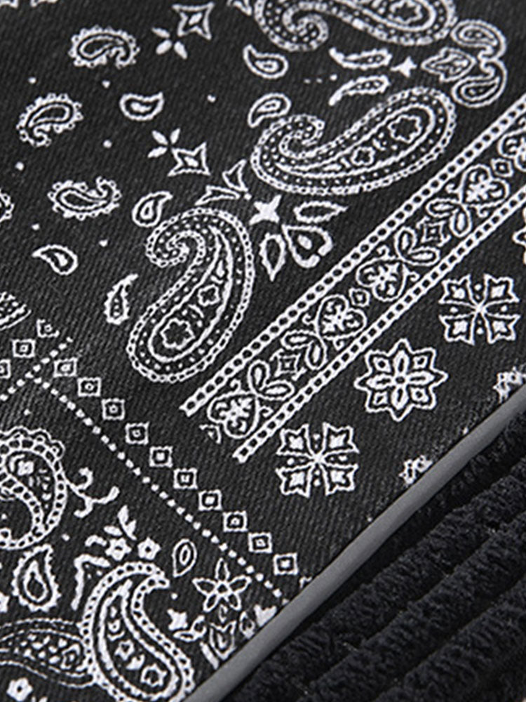 Calça de veludo cotelê com painéis estampados de paisley