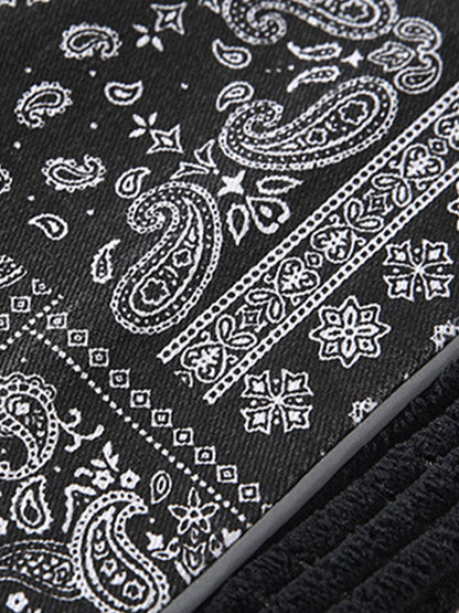 Calça de veludo cotelê com painéis estampados de paisley