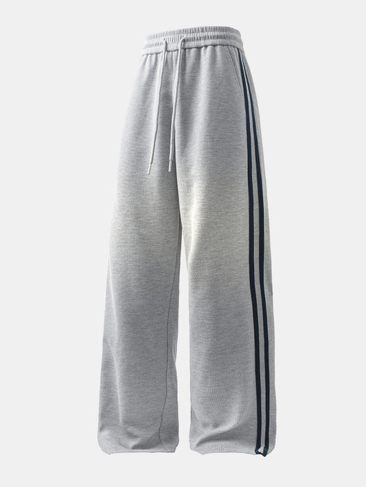 Calça de perna reta com listras contrastantes e textura waffle