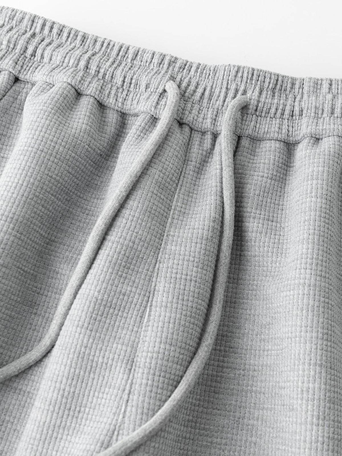 Calça de perna reta com listras contrastantes e textura waffle