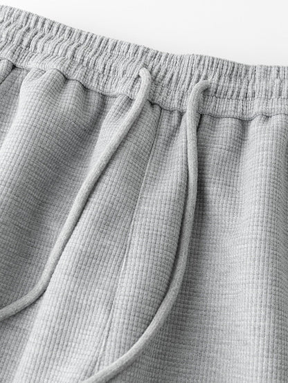 Calça de perna reta com listras contrastantes e textura waffle
