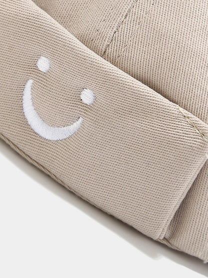 Boné ajustável de algodão sem viseira com bordado de carinha sorridente