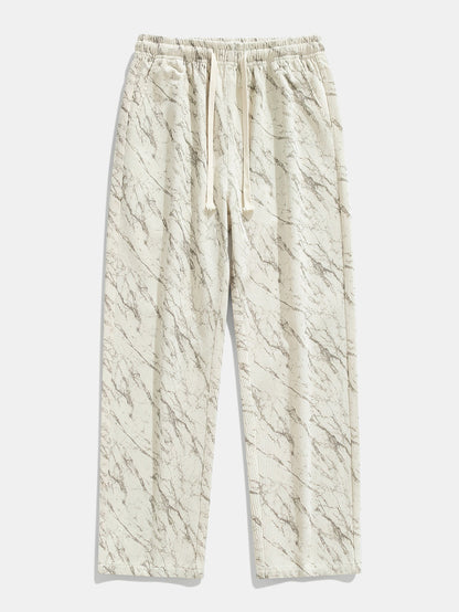 Calça de veludo cotelê com estampa marmorizada e perna reta