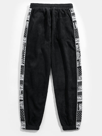 Calça de veludo cotelê com painéis estampados de paisley